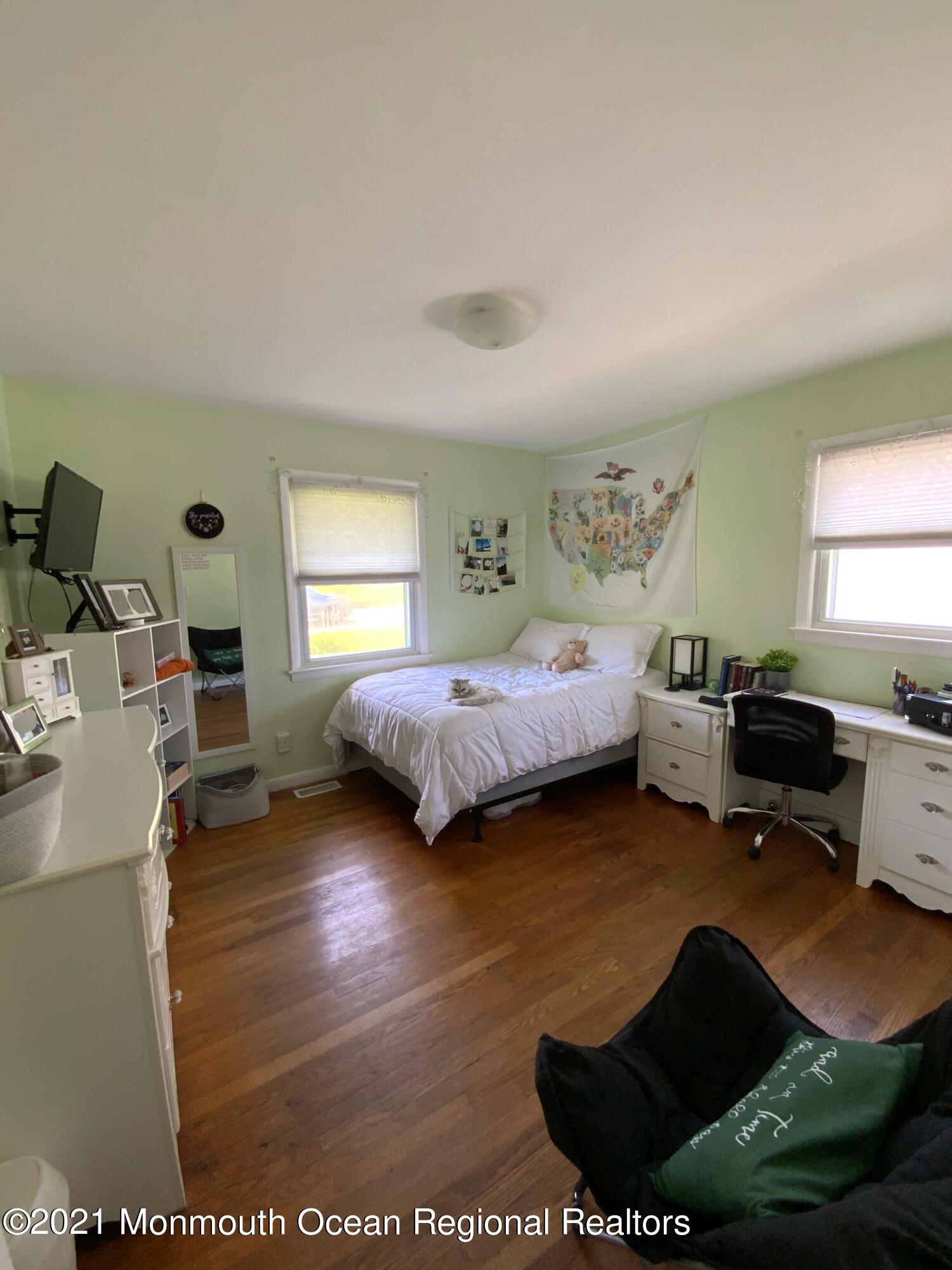 151 Ravine Drive Matawan, NJ 07747 - Photo 13 of 23 a bed room with a bed window and a dresser