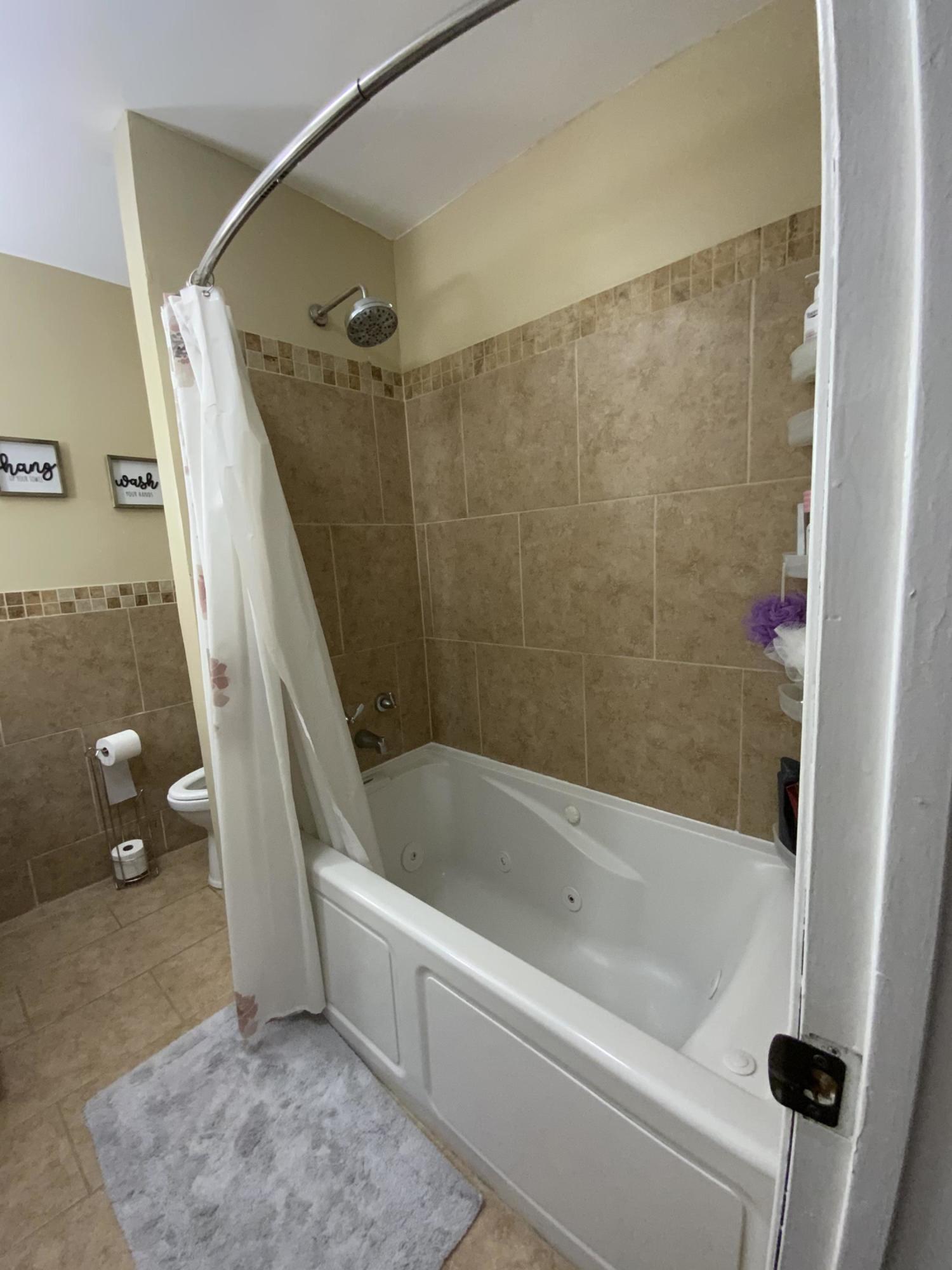 151 Ravine Drive Matawan, NJ 07747 - Photo 17 of 23 a bathroom with a shower and a bathtub