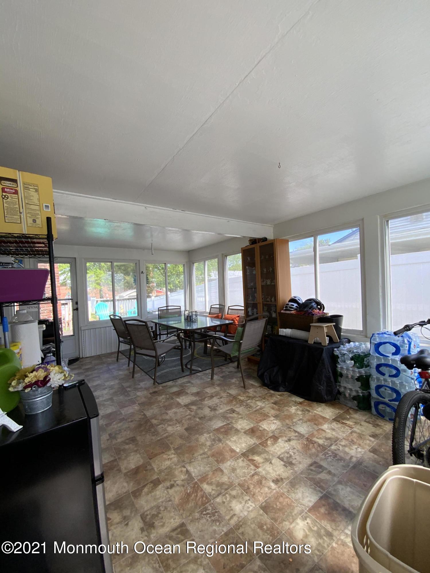 151 Ravine Drive Matawan, NJ 07747 - Photo 18 of 23 a living room with furniture and a large window