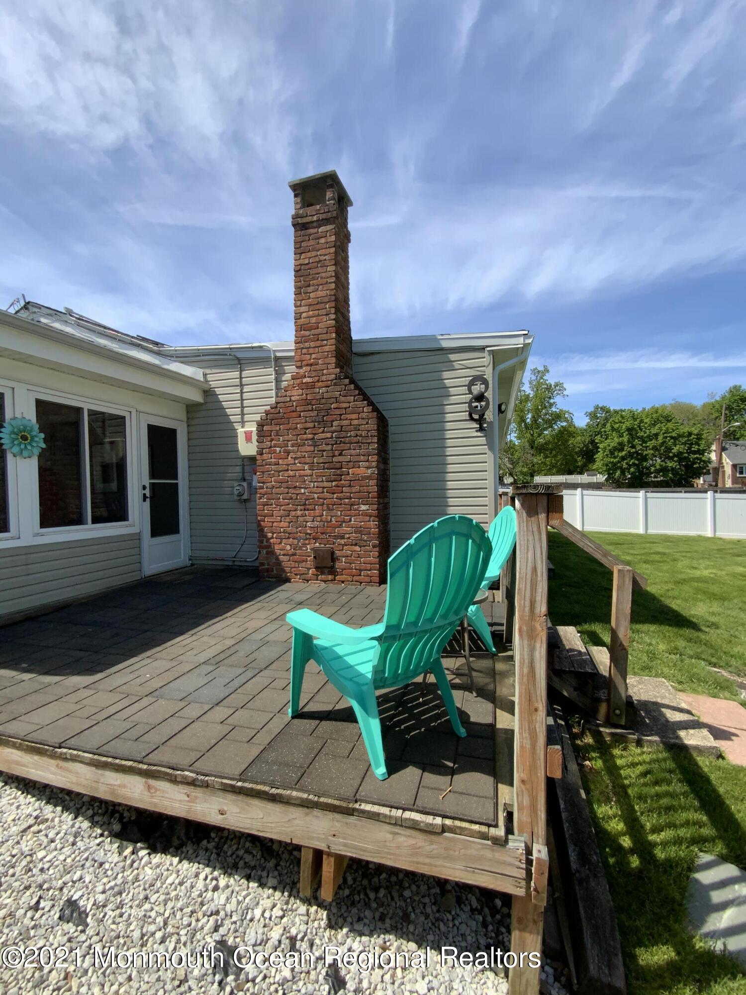 151 Ravine Drive Matawan, NJ 07747 - Photo 19 of 23 a front view of a house with garden
