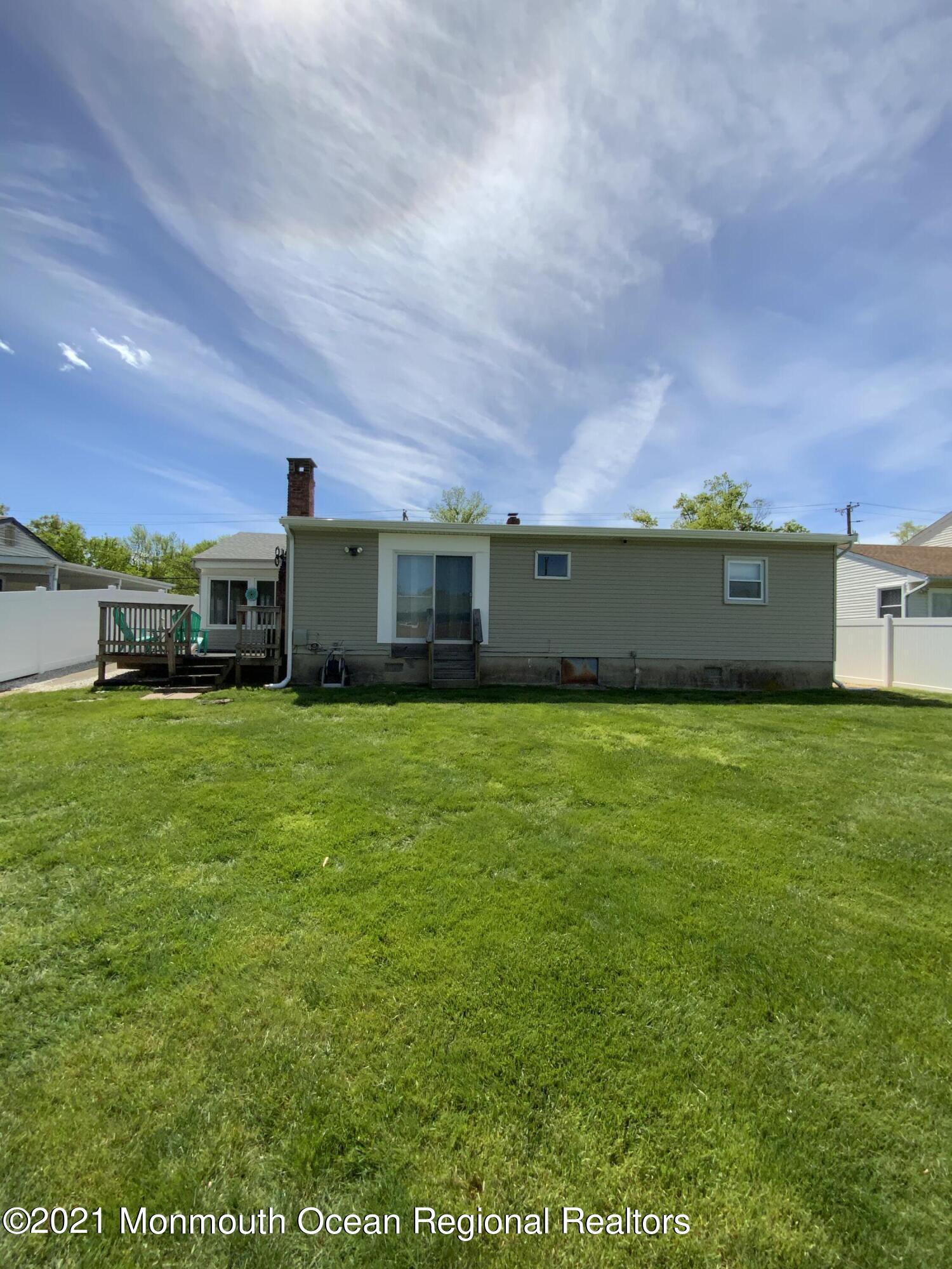 151 Ravine Drive Matawan, NJ 07747 - Photo 20 of 23 a view of a house with a big yard