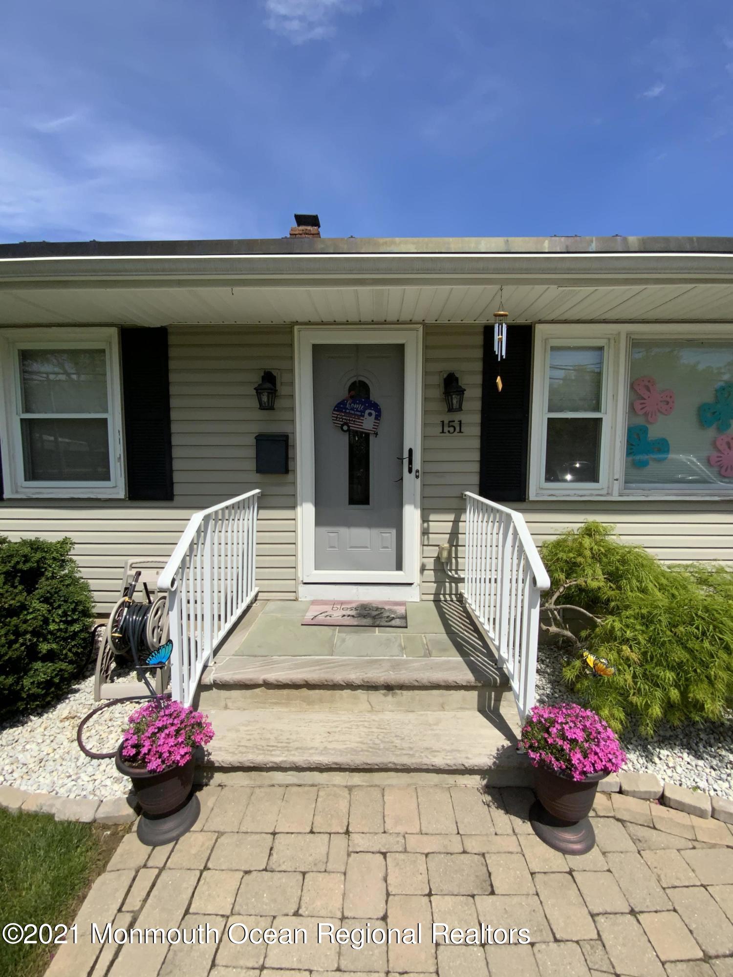 151 Ravine Drive Matawan, NJ 07747 - Photo 3 of 23 a front view of a house