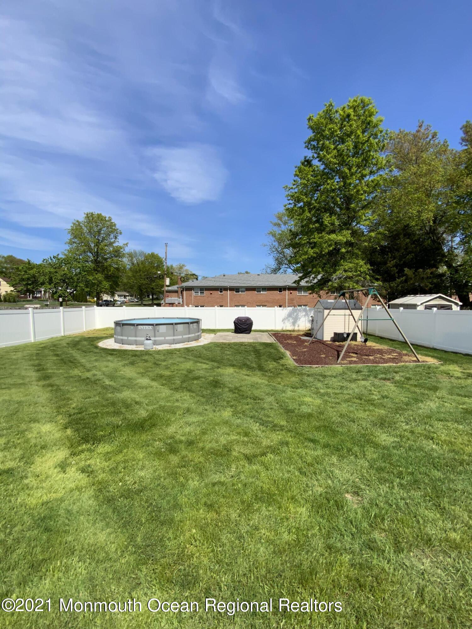 151 Ravine Drive Matawan, NJ 07747 - Photo 21 of 23 a view of a lake with a big yard