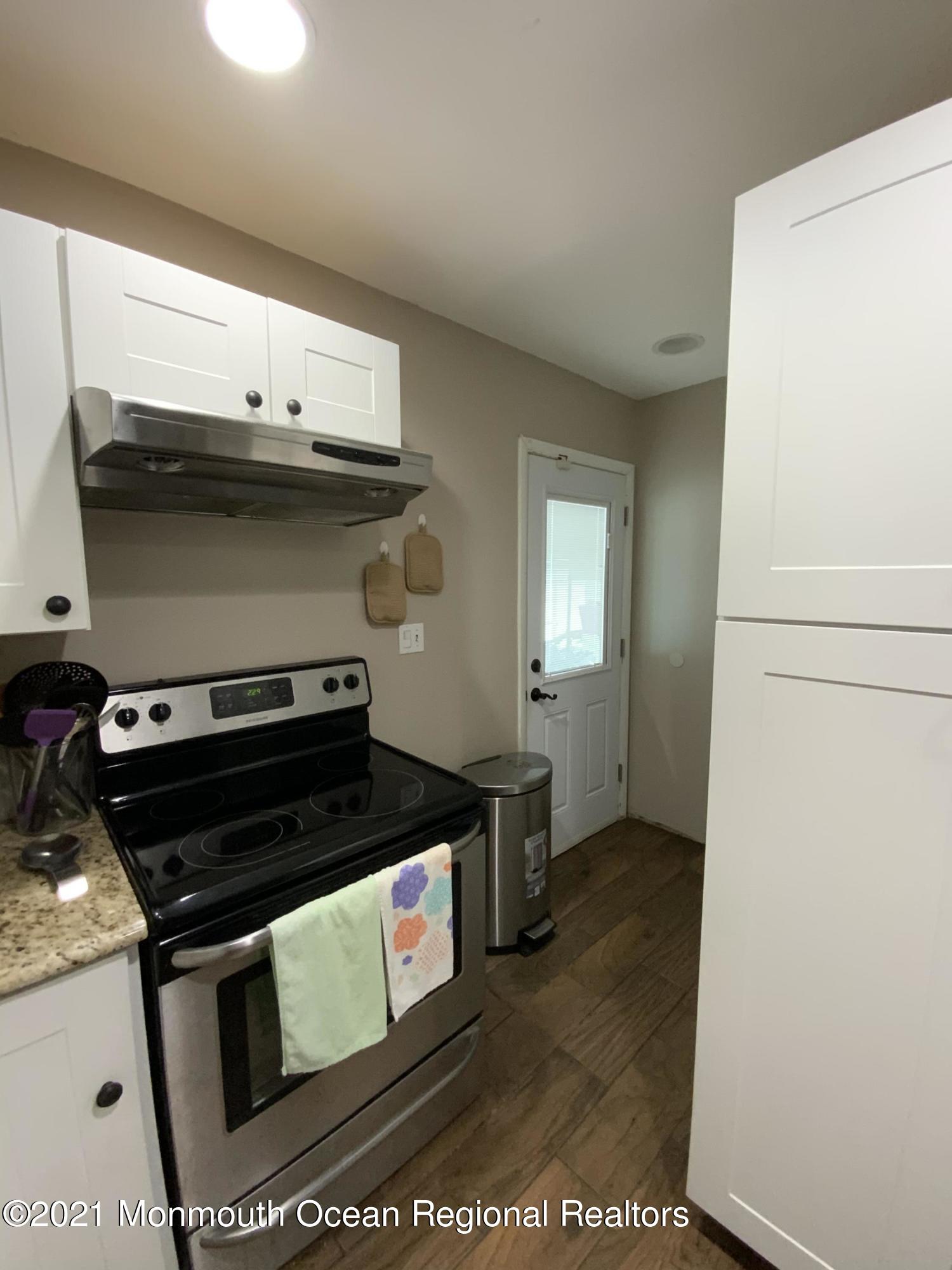 151 Ravine Drive Matawan, NJ 07747 - Photo 9 of 23 a stove top oven sitting inside of a kitchen