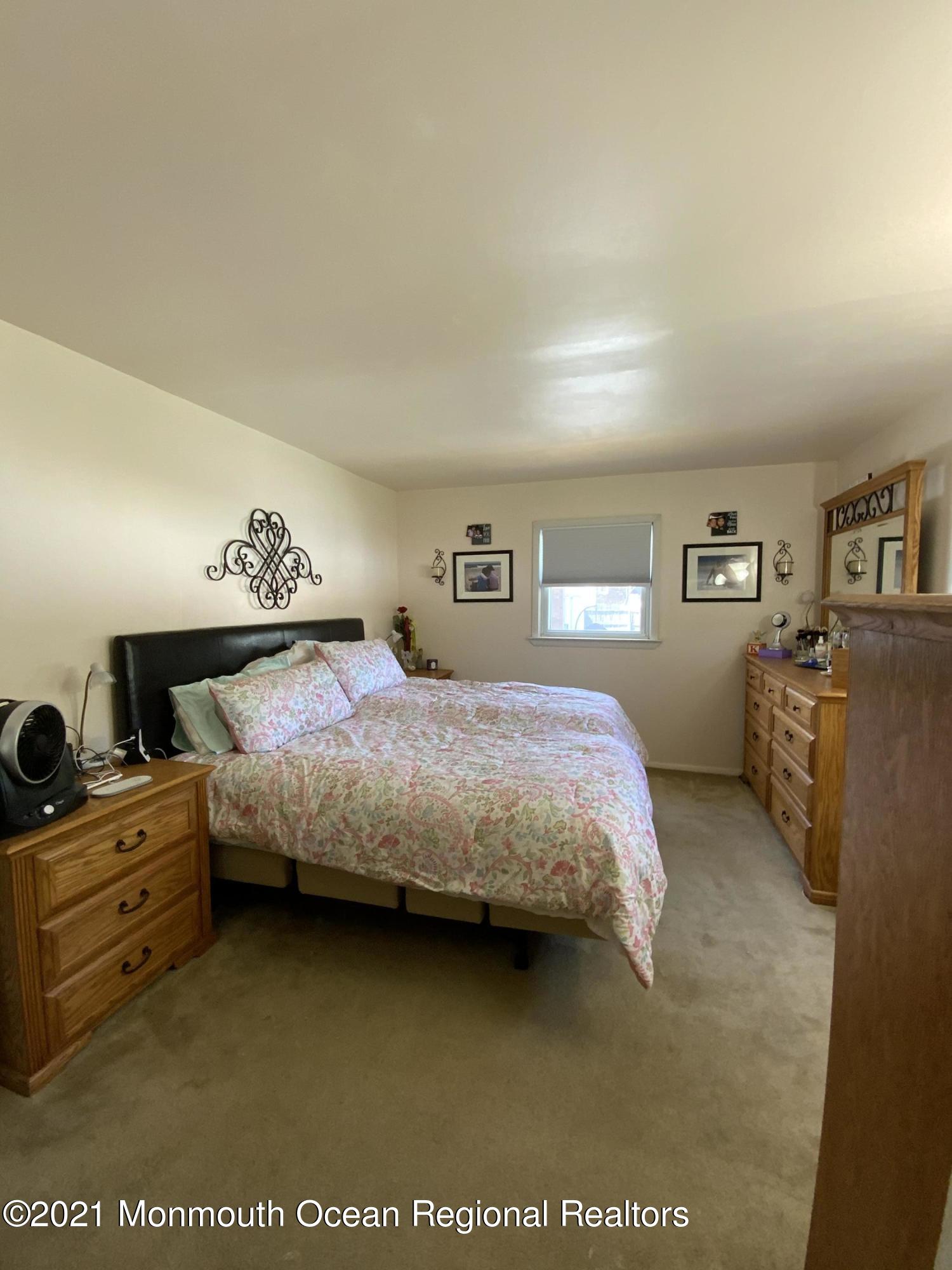 151 Ravine Drive Matawan, NJ 07747 - Photo 10 of 23 a bedroom with a bed and furniture