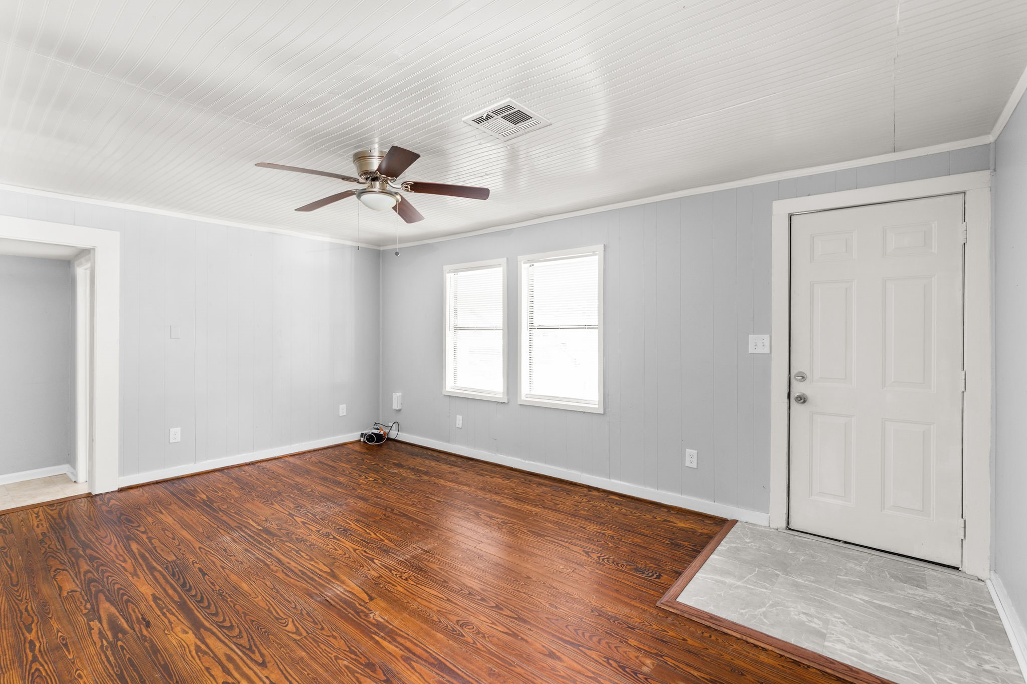 203 South Fig Street Sweeny, TX 77480 - Photo 3 of 20 Expansive living room with beautiful refinished hardwood floors and abundant natural light. Ready for your personal touch!