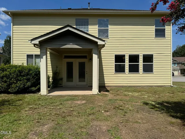 a house with yard in front of it