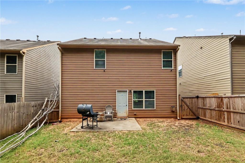 2780 Lakeview Walk Decatur, GA 30035 - Photo 35 of 37 a view of a house with a backyard and furniture