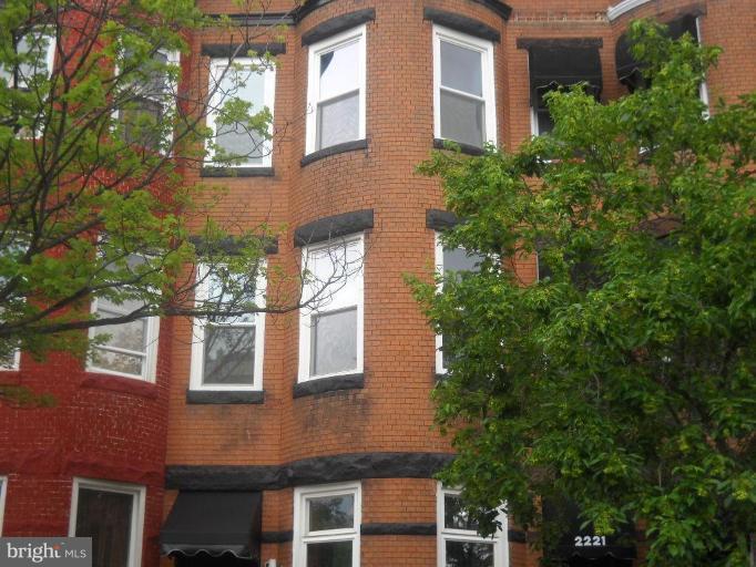 a front view of a multi story residential apartment building