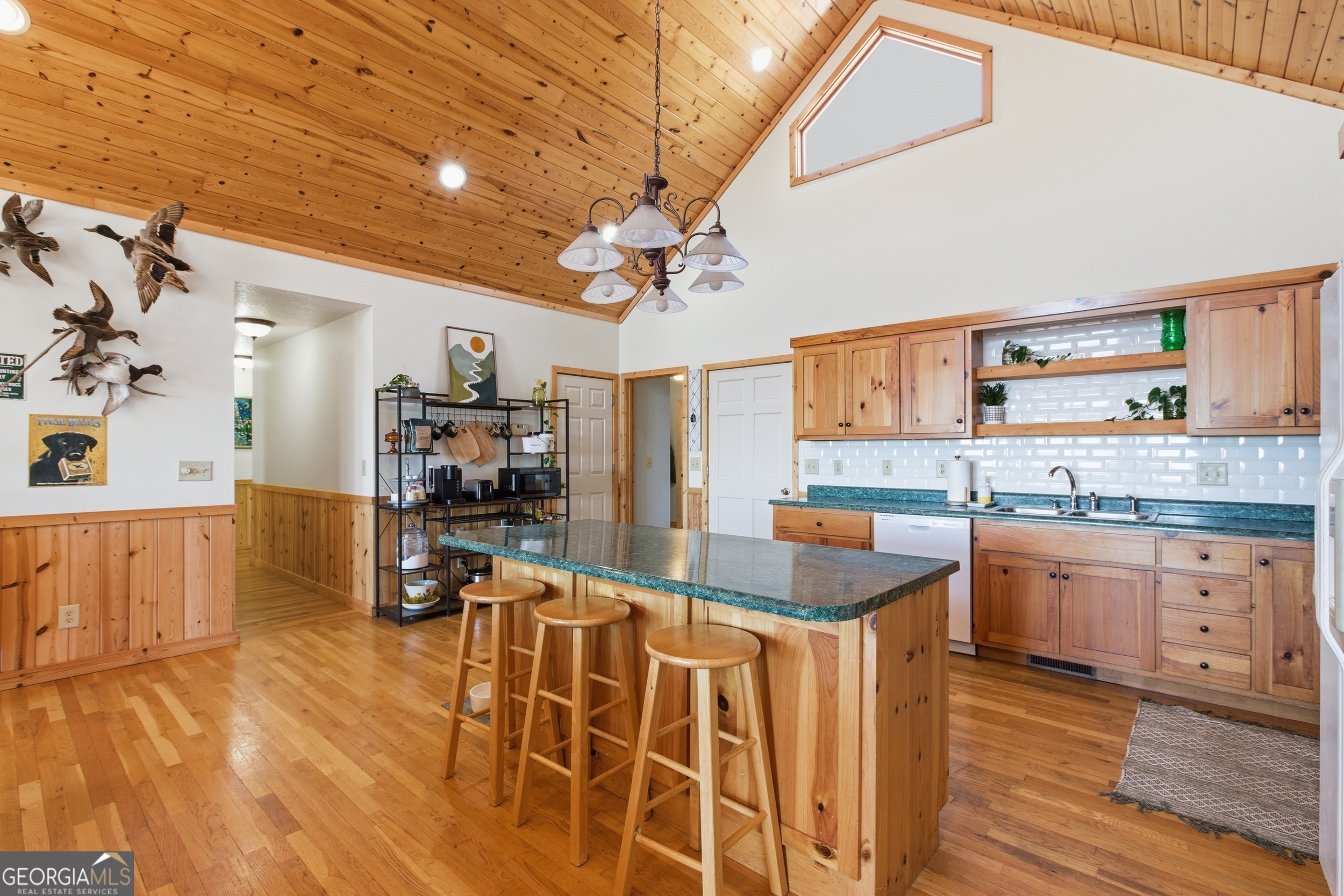 2280 Germany Road Clayton, GA 30525 - Photo 12 of 70 a kitchen with stainless steel appliances granite countertop a sink dishwasher stove and refrigerator with wooden floor