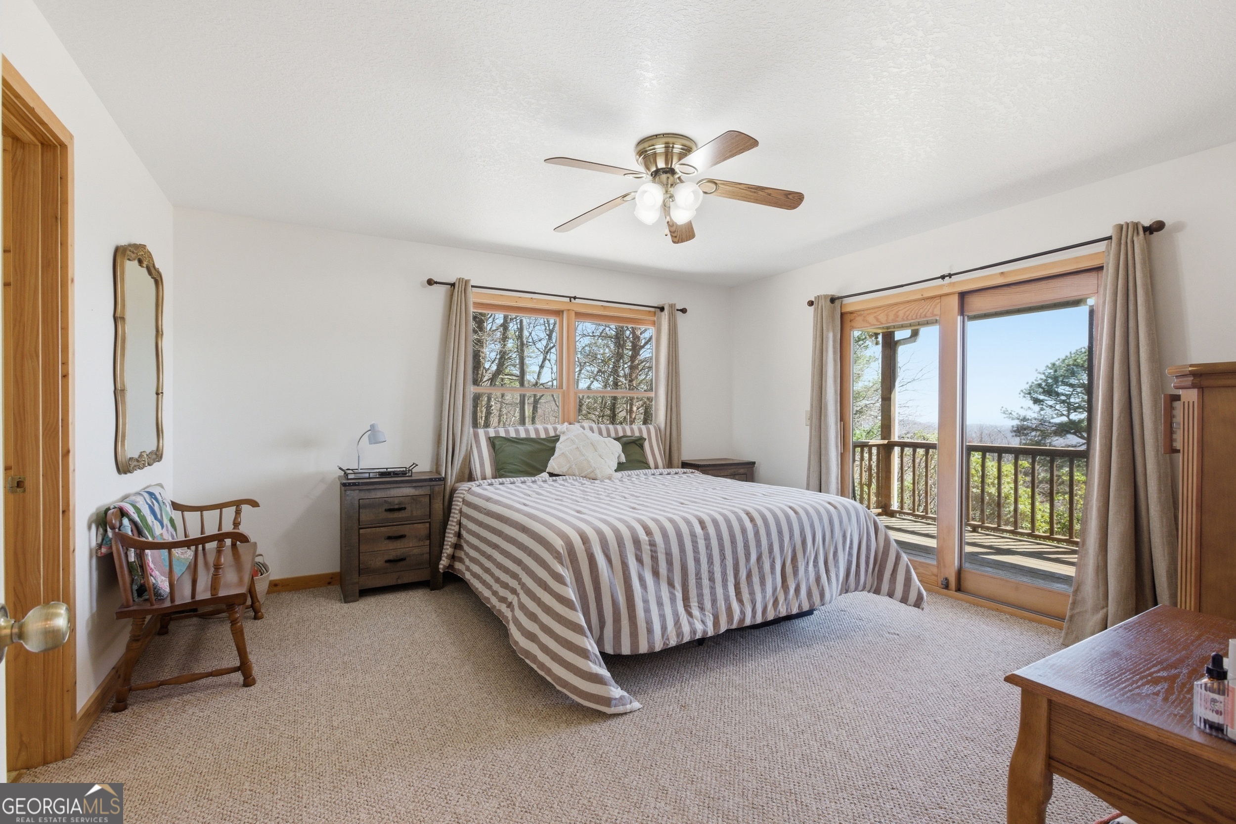 2280 Germany Road Clayton, GA 30525 - Photo 17 of 70 a bedroom with a bed and a chandelier