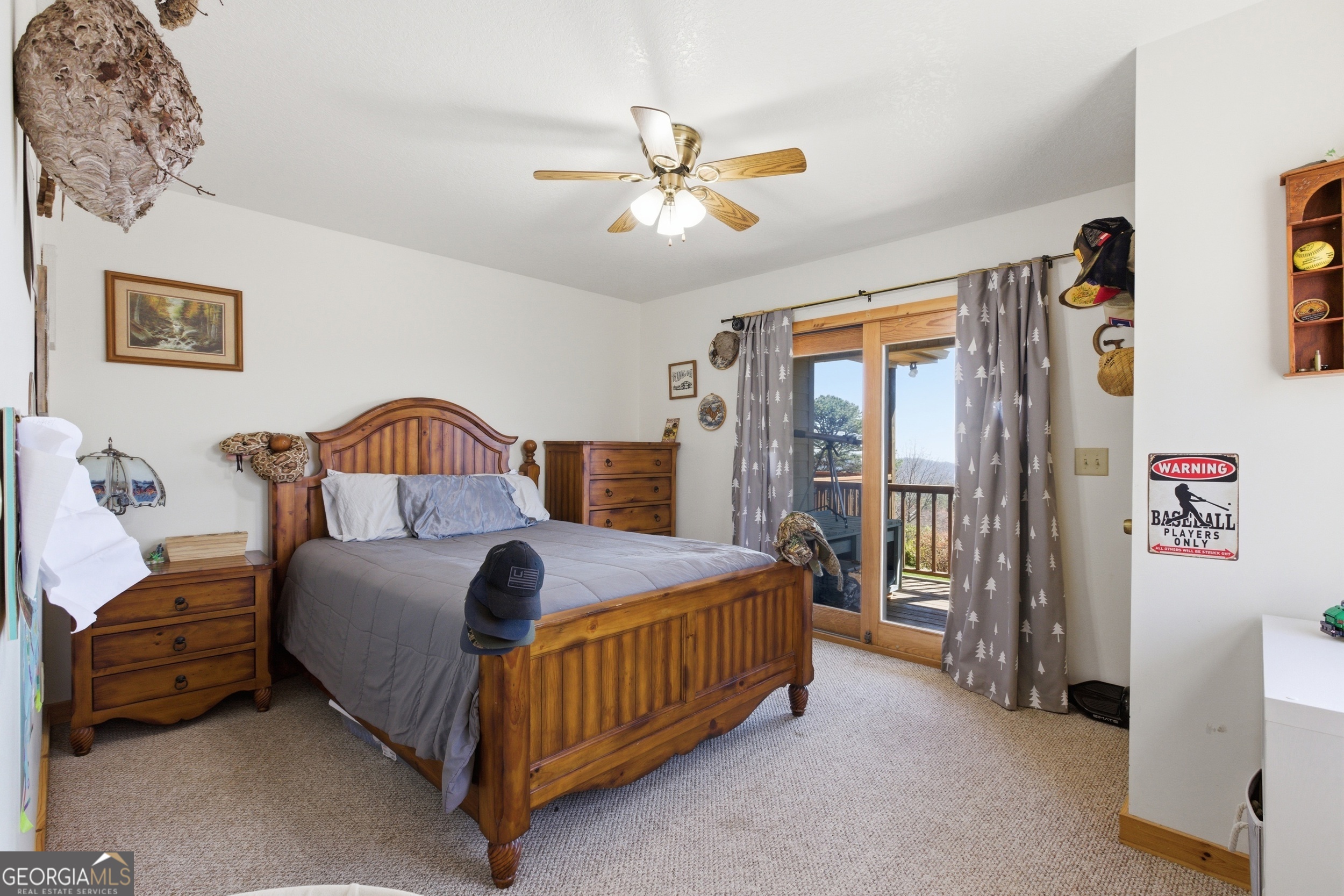 2280 Germany Road Clayton, GA 30525 - Photo 25 of 70 a bedroom with a bed and a chandelier