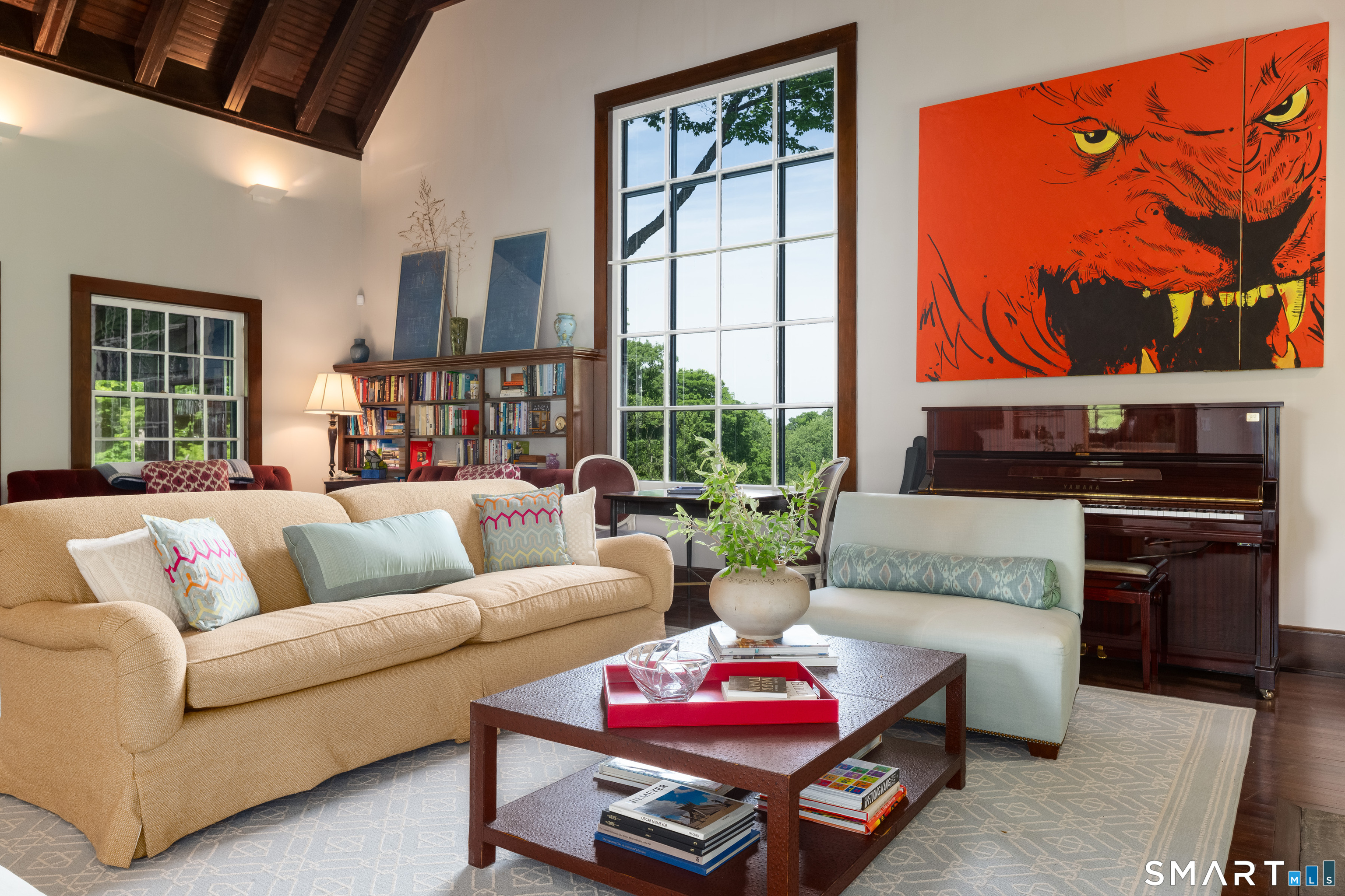 240 Umpawaug Road Redding, CT 06896 - Photo 8 of 40 The Great Room. Soaring double-height beamed wood ceiling and a stunning, original, picture window that looks out over the lush landscape..