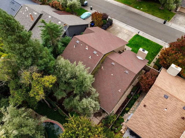 an aerial view of house with yard