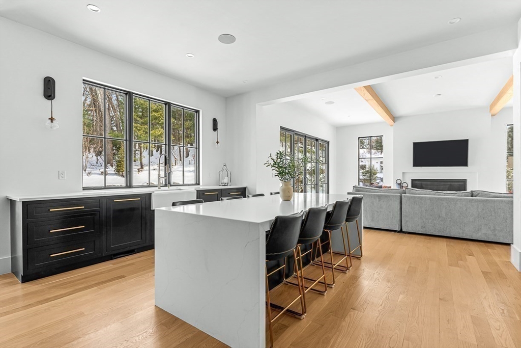 54 Johnson Road Winchester, MA 01890 - Photo 14 of 42 a view of a kitchen with kitchen island and windows in it