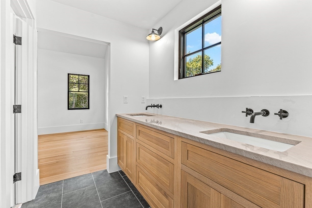 54 Johnson Road Winchester, MA 01890 - Photo 22 of 42 a bathroom with a sink and a mirror