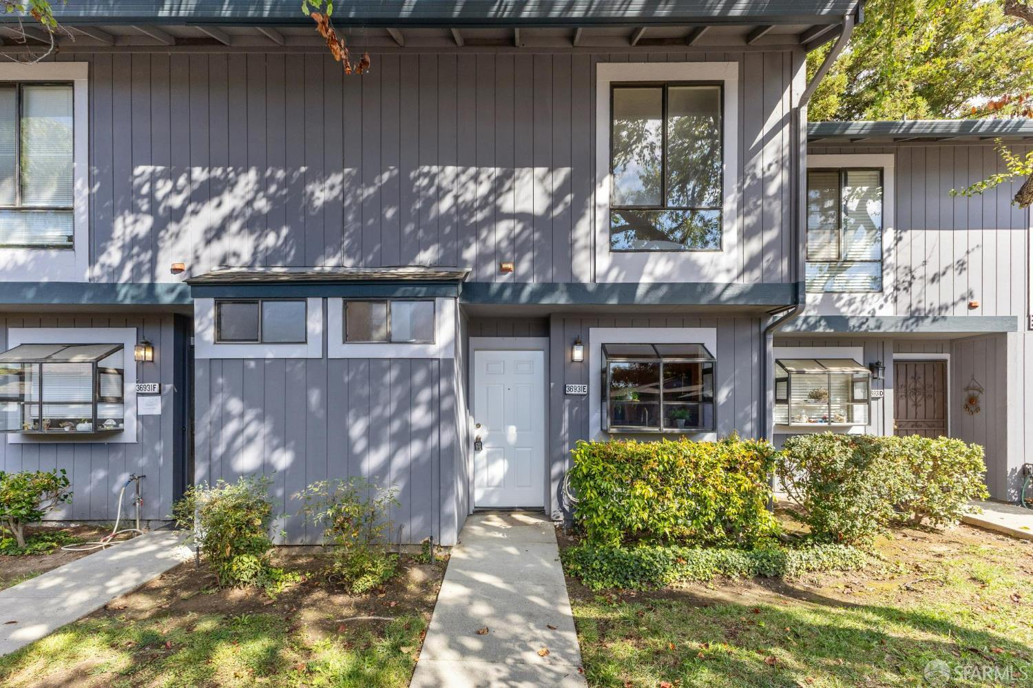 36931 Newark Boulevard, Unit E Newark, CA 94560 - Photo 1 of 37 front view of a house with a yard