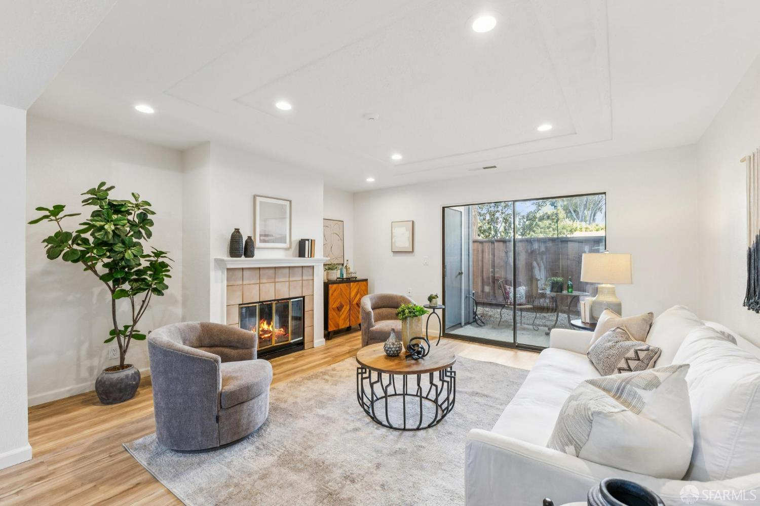 36931 Newark Boulevard, Unit E Newark, CA 94560 - Photo 11 of 37 a living room with furniture potted plant and a fireplace