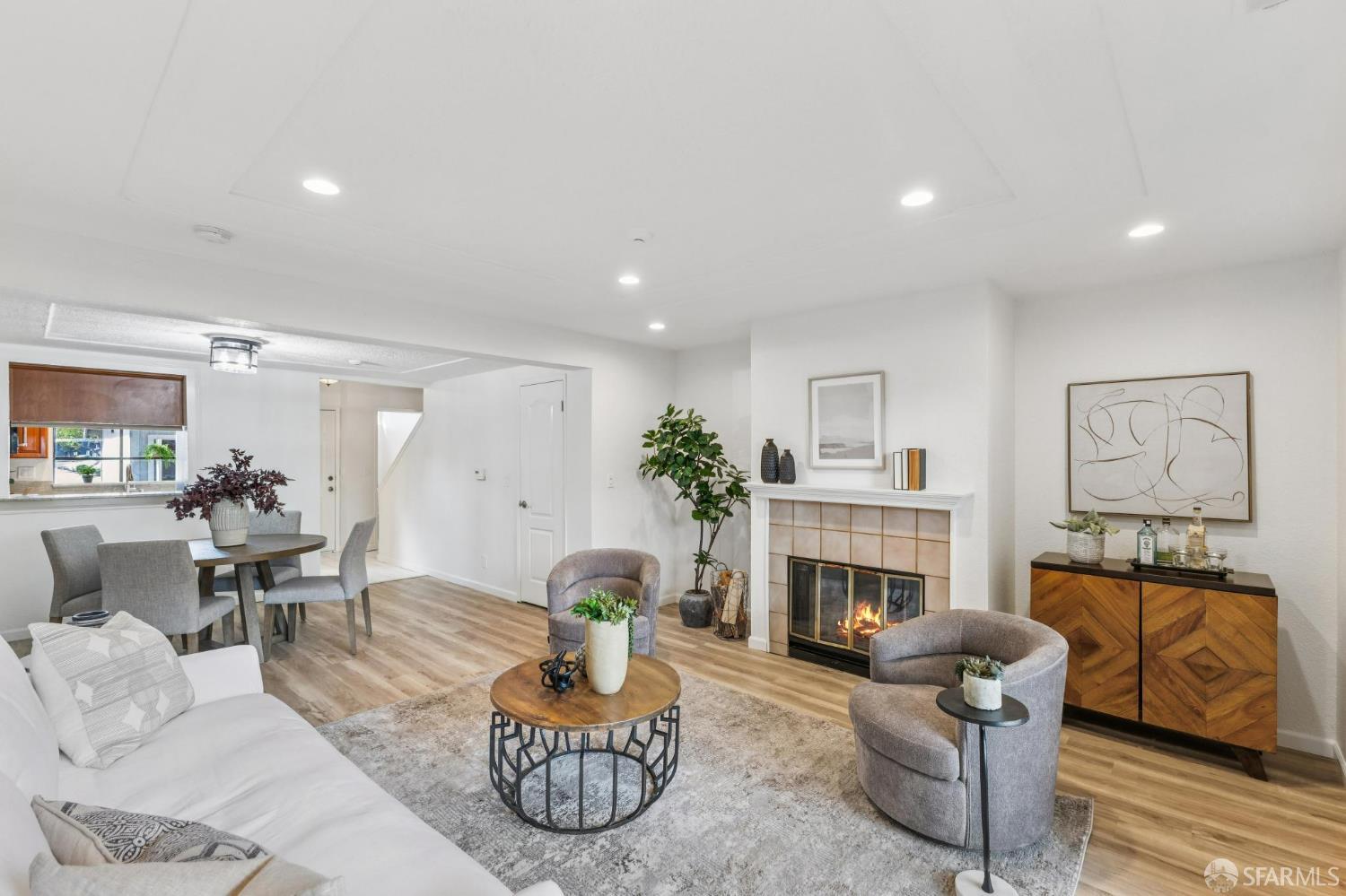 36931 Newark Boulevard, Unit E Newark, CA 94560 - Photo 12 of 37 a living room with furniture a fireplace and potted plants