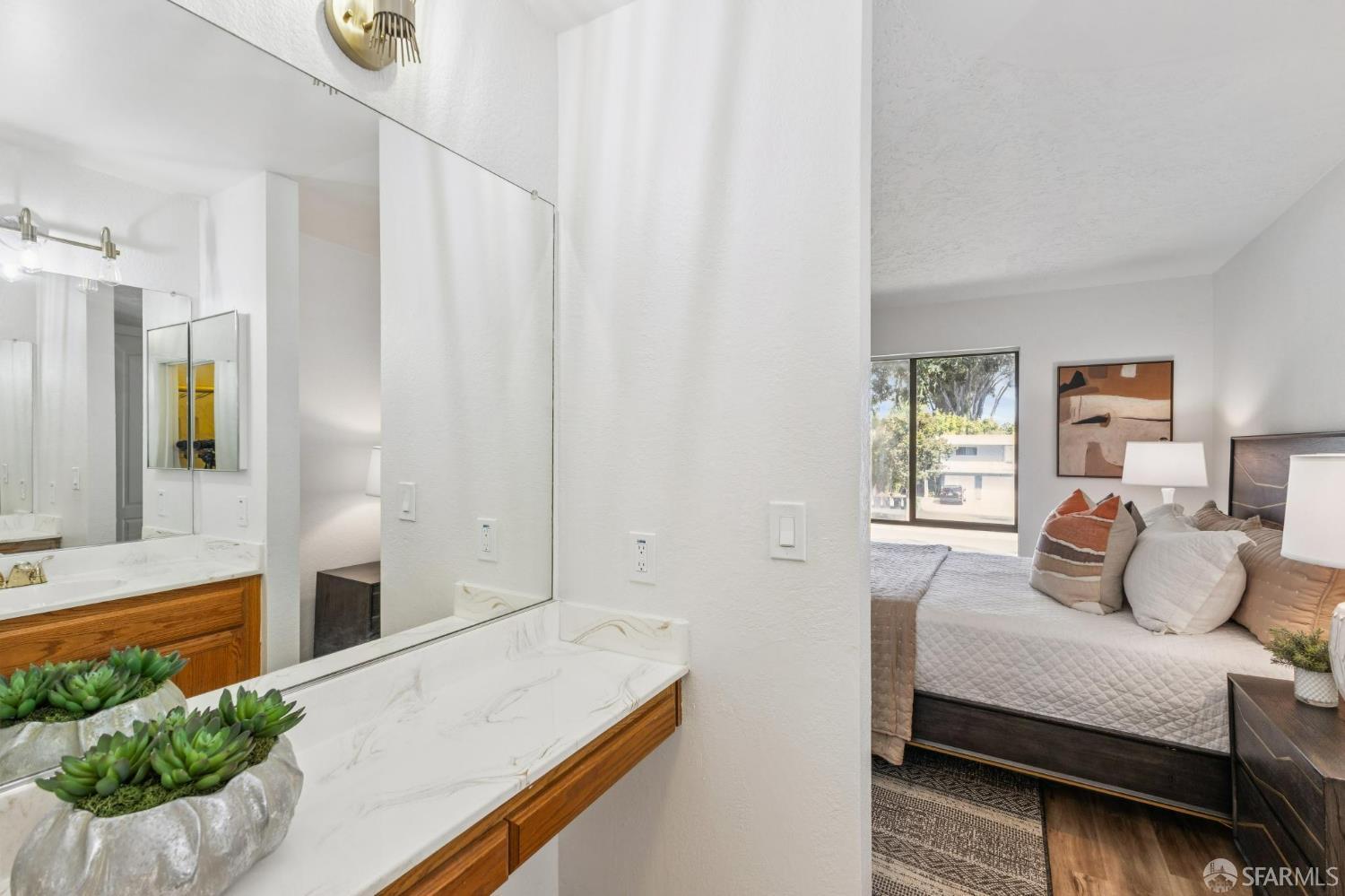 36931 Newark Boulevard, Unit E Newark, CA 94560 - Photo 19 of 37 a bedroom with a bed and a window