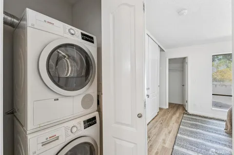 a view of a hallway with washer and dryer