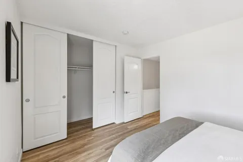 a bedroom with a bed and a closet