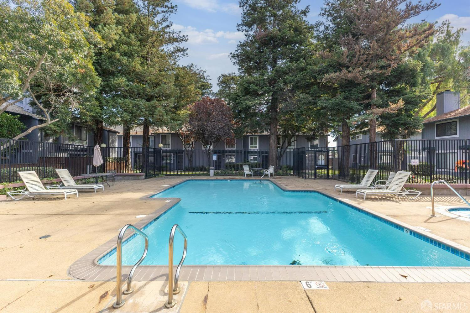 36931 Newark Boulevard, Unit E Newark, CA 94560 - Photo 30 of 37 a view of a swimming pool with a patio