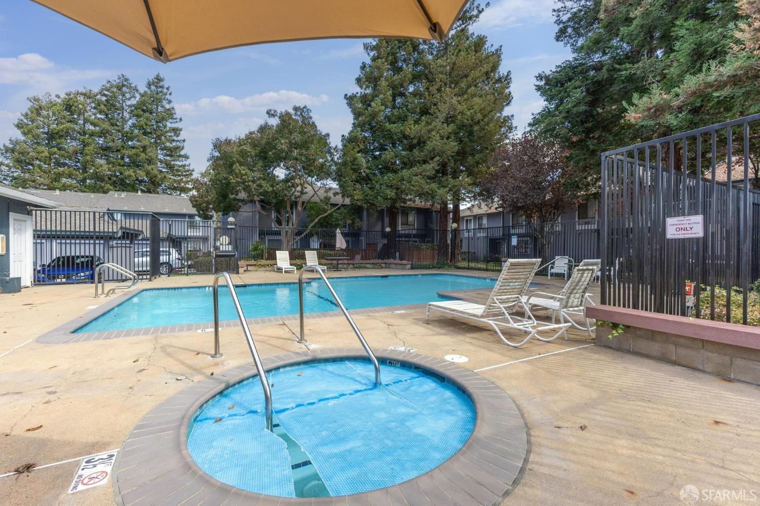 36931 Newark Boulevard, Unit E Newark, CA 94560 - Photo 31 of 37 a view of a swimming pool with a lounge chair