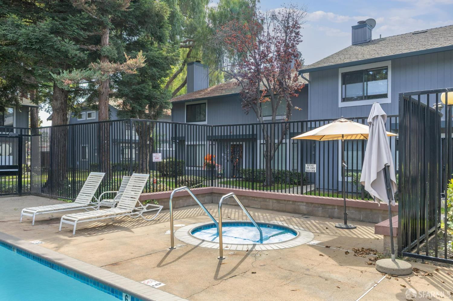 36931 Newark Boulevard, Unit E Newark, CA 94560 - Photo 32 of 37 a view of a house with backyard and sitting area