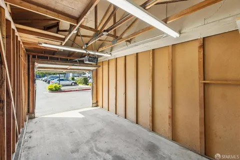 a view of a garage with wooden wall