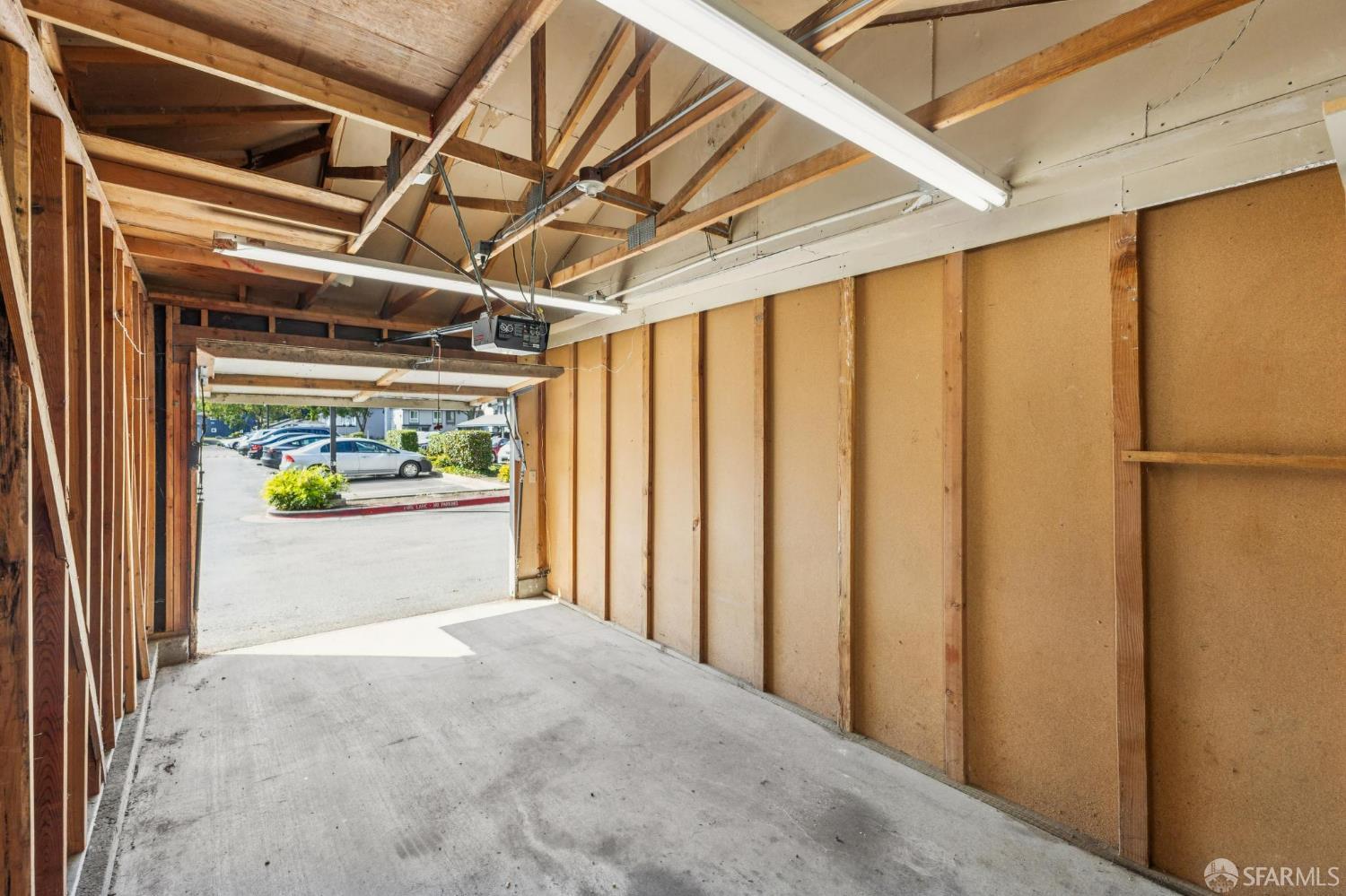 36931 Newark Boulevard, Unit E Newark, CA 94560 - Photo 33 of 37 a view of a garage with wooden wall