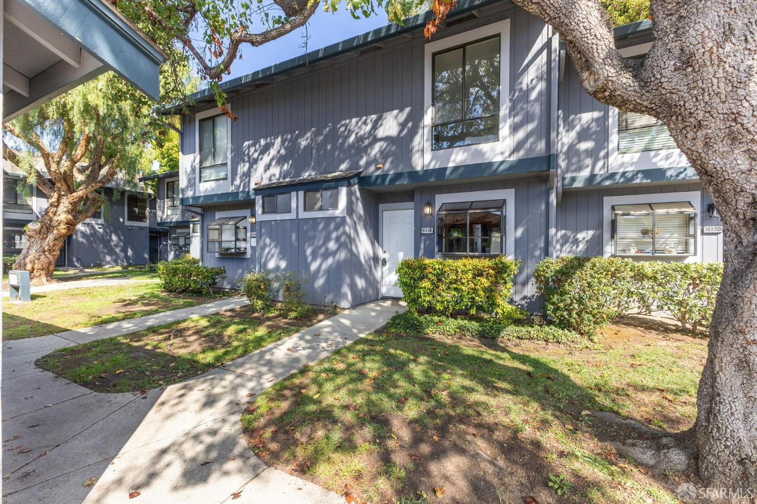 36931 Newark Boulevard, Unit E Newark, CA 94560 - Photo 35 of 37 a view of a house with a large tree