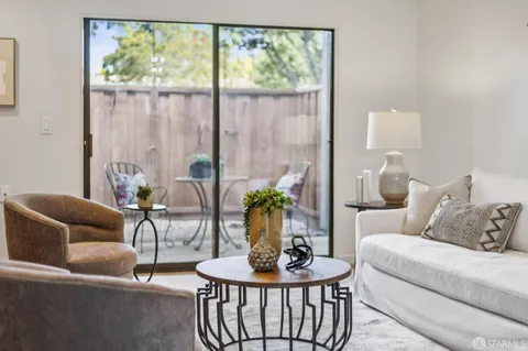 a living room with furniture and a table