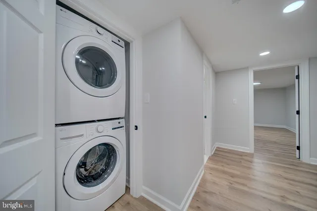 a view of a hallway with washer and dryer