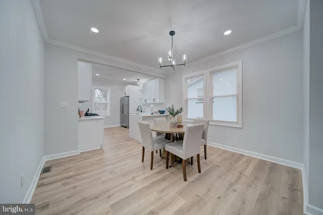 a view of a dining room with furniture and window