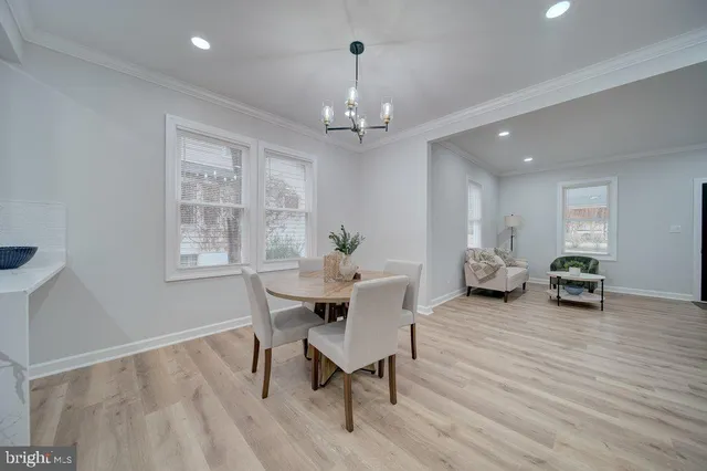 a view of a livingroom with furniture and chandelier