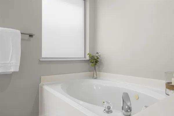 a white bath tub sitting in a bathroom
