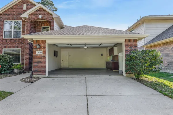 a front view of a house with a garage