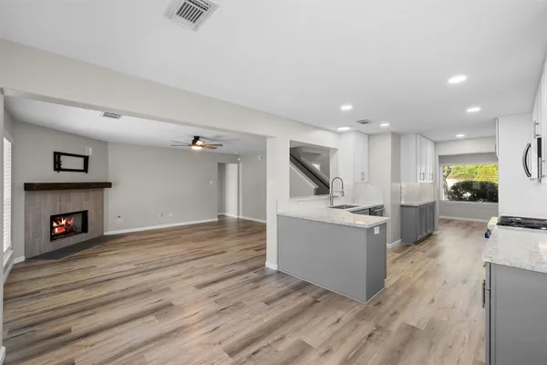 a view of kitchen with furniture and wooden floor