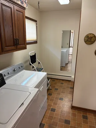 a utility room with dryer and washer