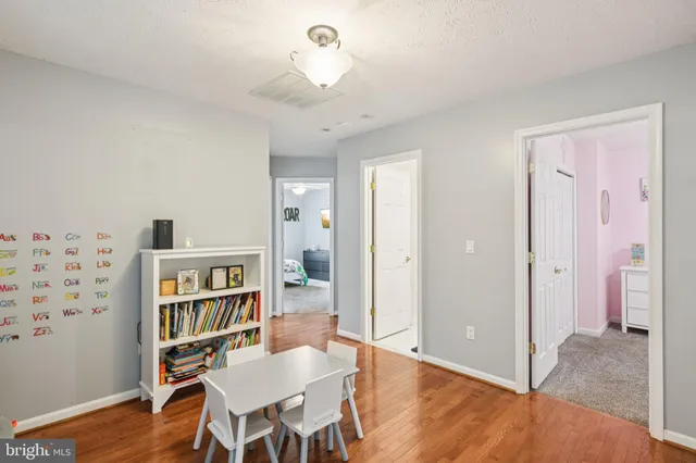 a view of a livingroom with furniture and wooden floor