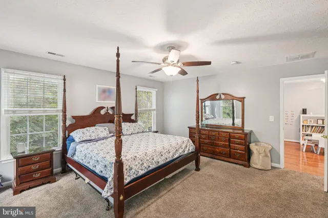 a bed room with a bed and a chandelier