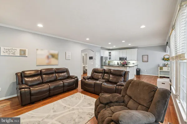a living room with furniture window and a couch