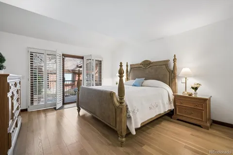 a bed room with a bed and a large window