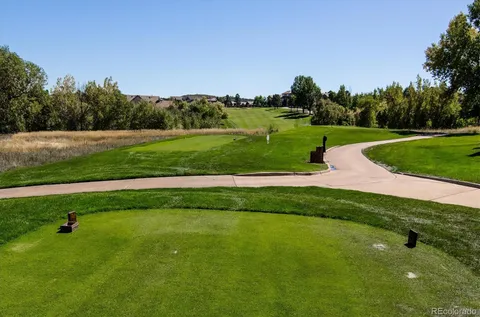a view of a golf course with a park