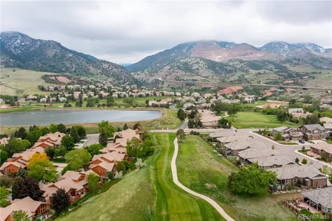 an aerial view of a city with mountains