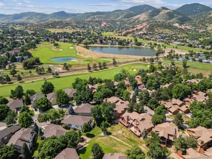 an aerial view of a city with mountains