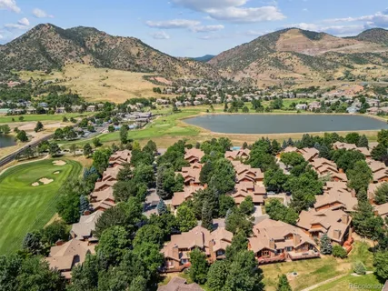 an aerial view of lake residential house with swimming pool and green space