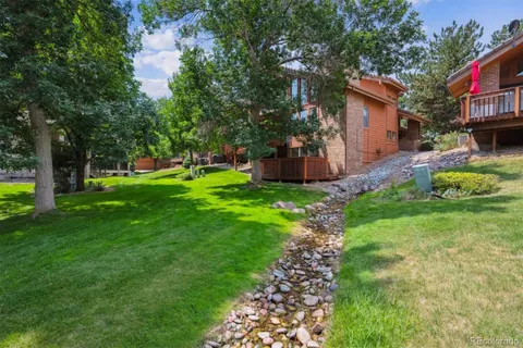 a house view with a sitting space and garden