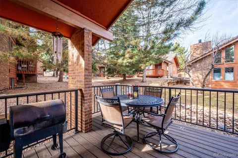a view of a chair and table in the balcony